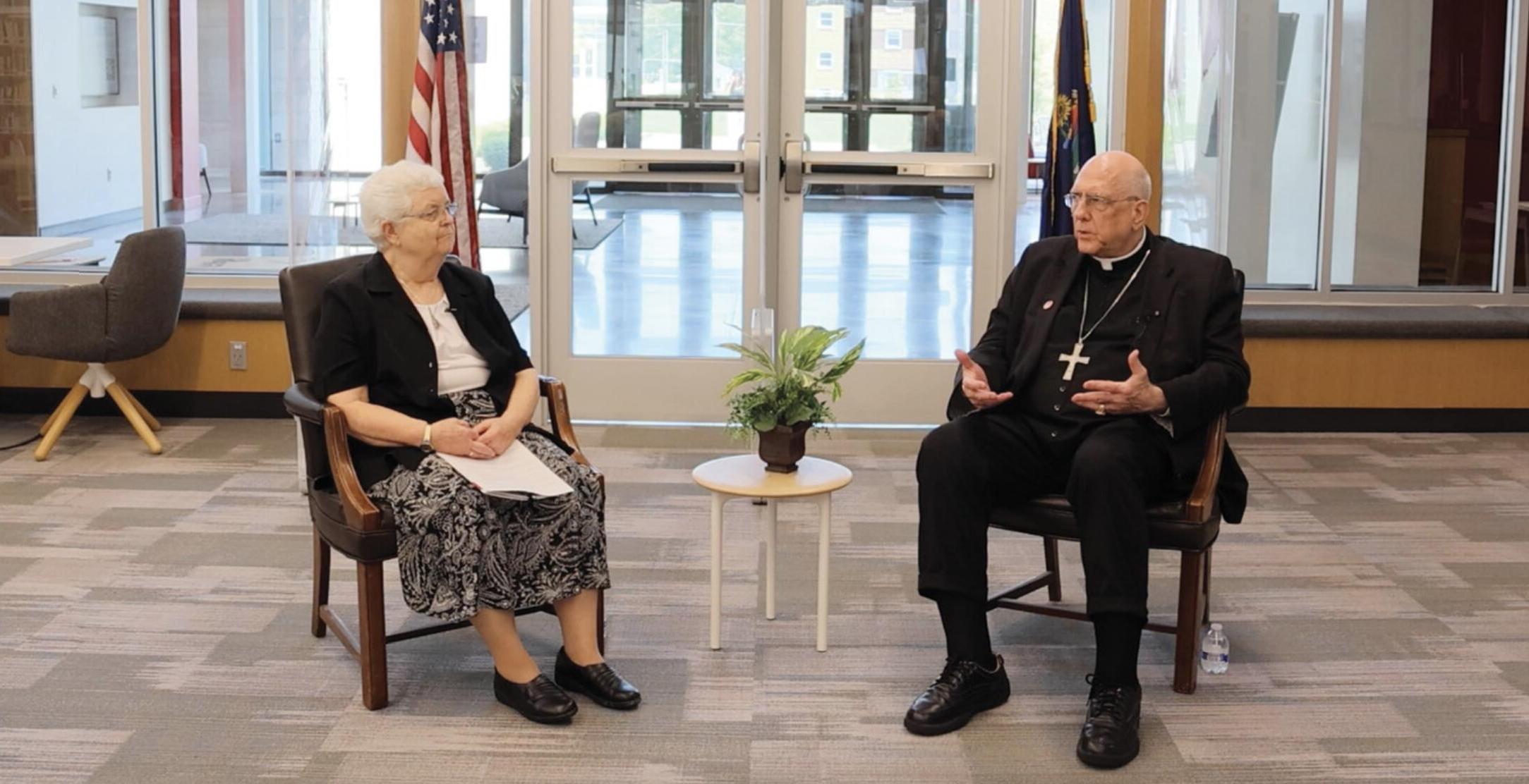 Archbishop Joseph Naumann sitting with Sister Mary Elizabeth Schweiger